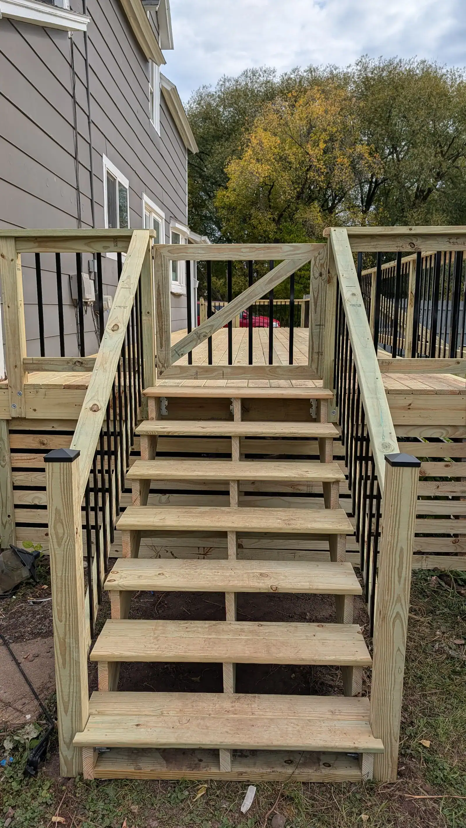 Completed deck from second angle showing railing and stairs