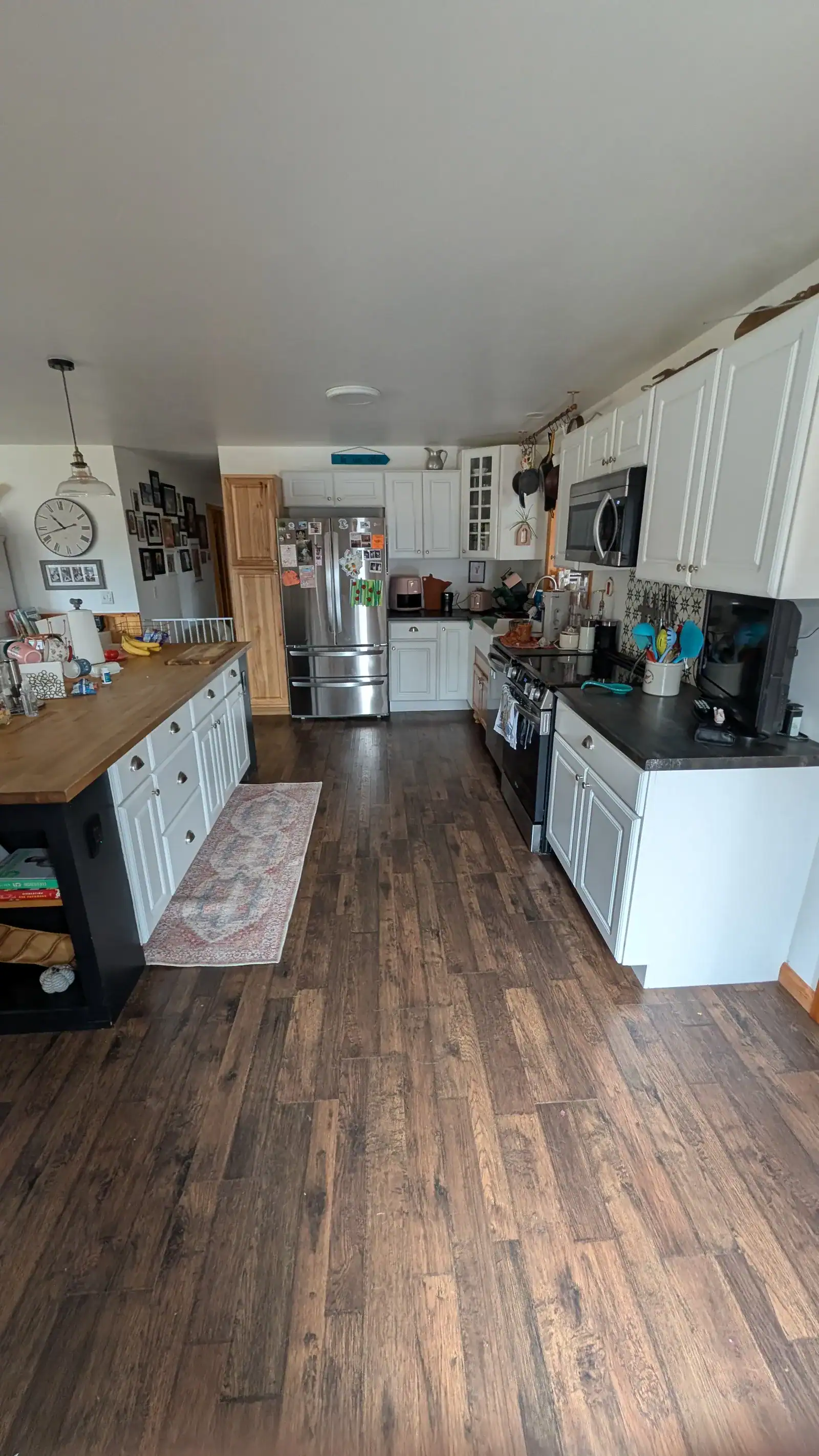 Renovated kitchen with updated cabinets, countertops, and modern finishes